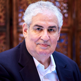 Image of David DeRosa in a white shirt and a navy blazer